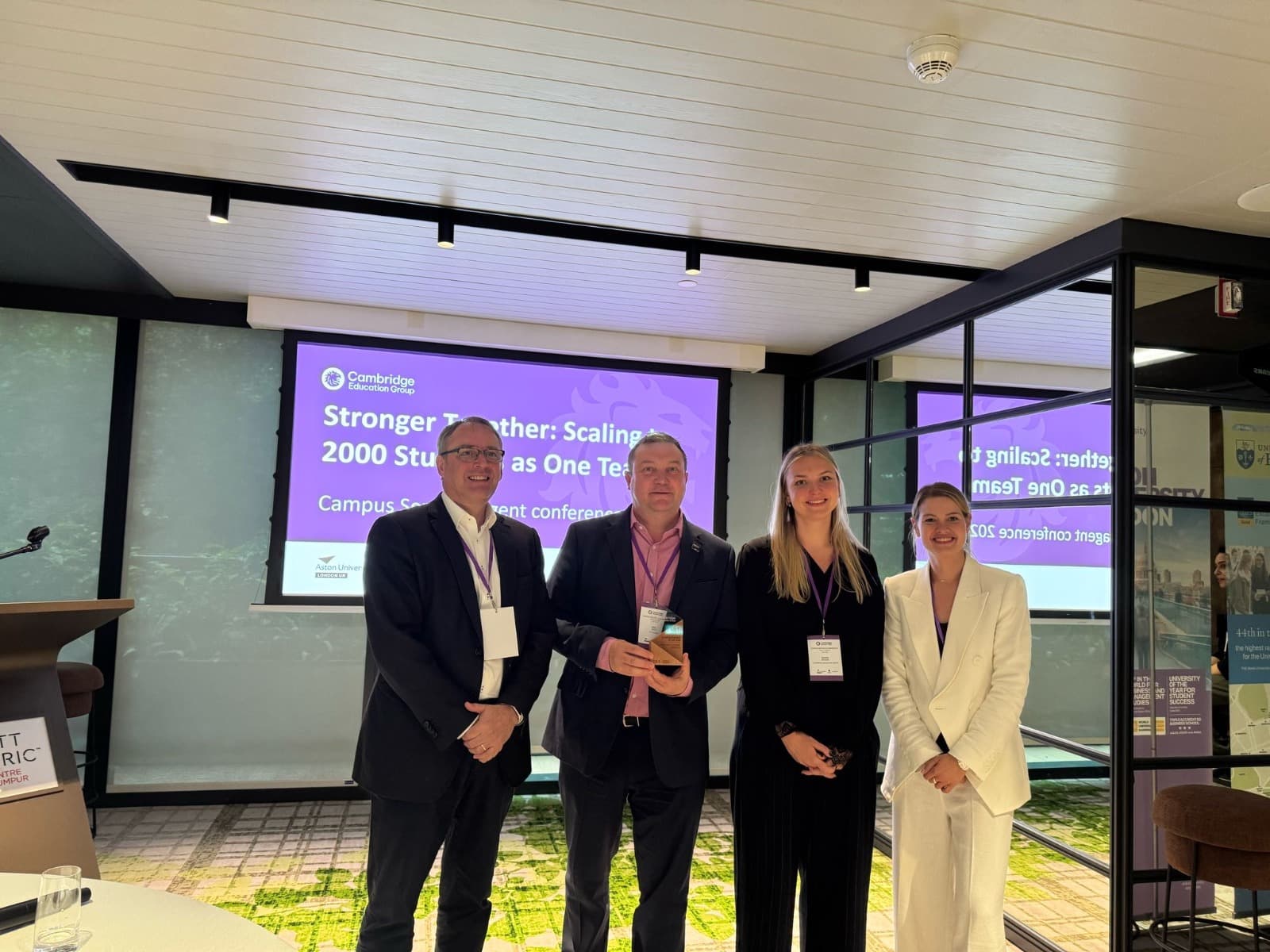 Neil Upton receiving Business Partner of the Year award 2025 from Cambridge Education Group